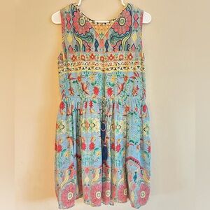 Sleeveless dress with hand sewn beading and embroidery